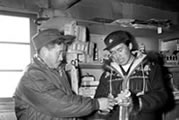 Charlie Masazumi and son Alfred at the trading post. Colville Lake, NWT, 1963.                