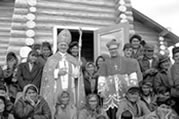 The blessing of the new church. Cardinal Pignedoli and Bishop Piché stand outside with the congregation. Colville Lake, NWT, 1964. 