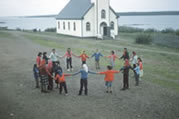 Children dancing in a circle. Fond du Lac, Saskatchewan, 1960. 