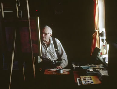 Bern Will Brown painting in his studio at Colville Lake, 2000 